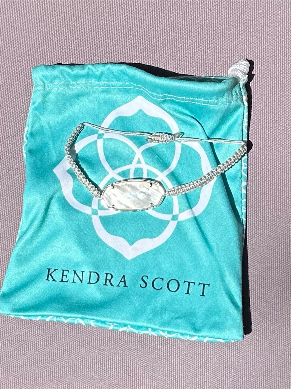 Kendra Scott Silver Macramé Bracelet with Iridescent White Stone and Teal Pouch
